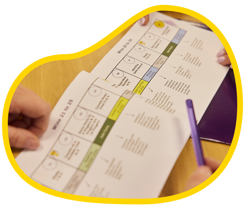 Photo of someone working on a Winning With Numbers booklet.