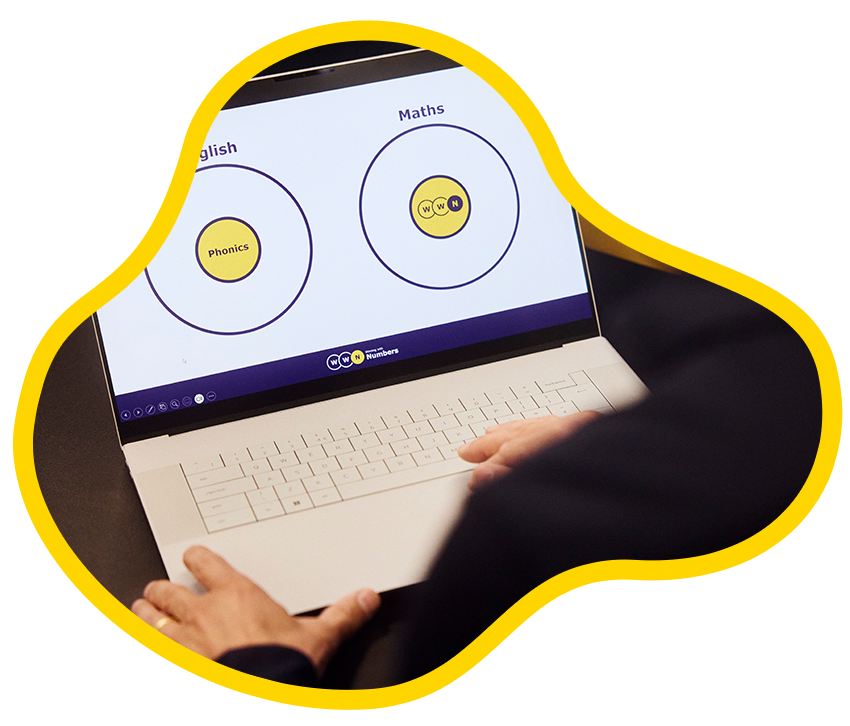 Photo of Ben working on a presentation on a laptop